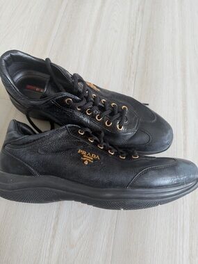 Prada womens Black Leather Sneakers with Gold Accents